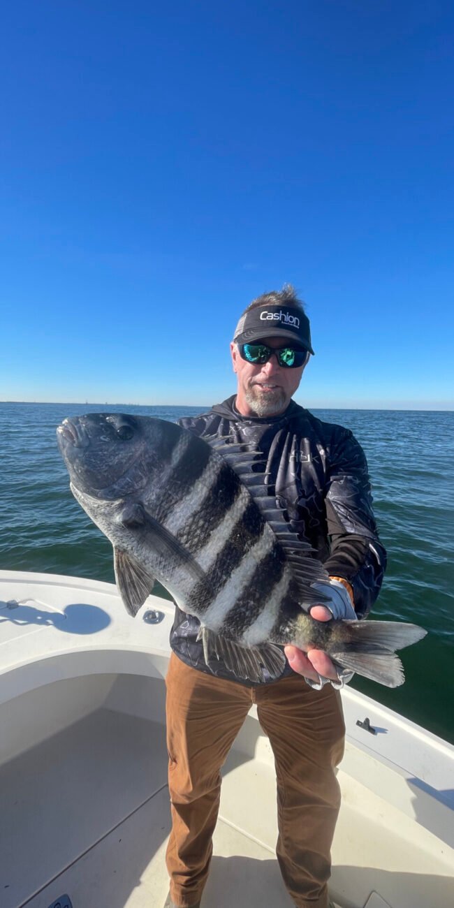 A catch held up aboard Reel Escapes